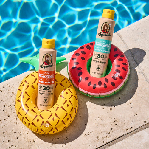 Dr Squatch spray sunscreen by the pool 30 SPF Coconut Castaway and Amber Solstice
